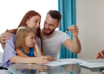 parents showing key to daughter